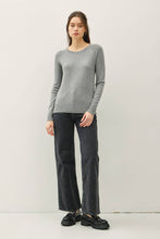Load image into Gallery viewer, Woman wearing a gray sweater and black pants on a white background

