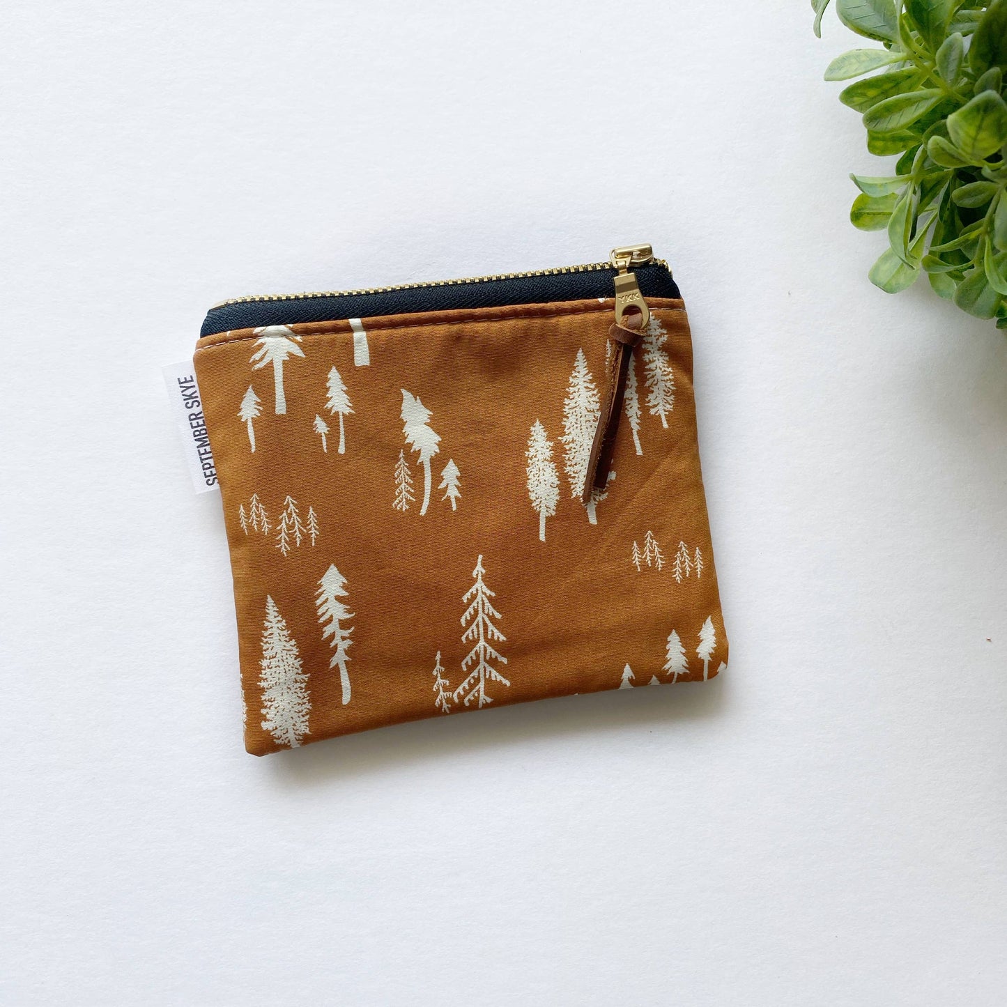Small square pouch in roots of nature rust