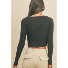 Load image into Gallery viewer, Person wearing a black ribbed long-sleeve crop top and beige pants on a beige background
